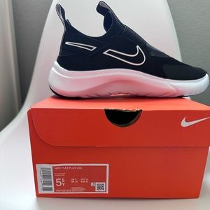 Nike flex plus black sneaker. Never worn. Size 5.5 youth